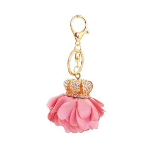 Pink fabric flower keychain with golden rhinestone crown pendant and swivel lobster clasp