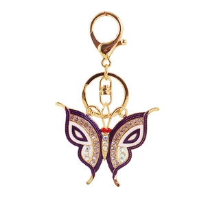 Golden butterfly keychain with purple enamel and sparkling rhinestones for bags