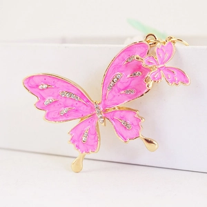 Sparkly pink butterfly keychain with rhinestones and gold enamel for bags and car keys