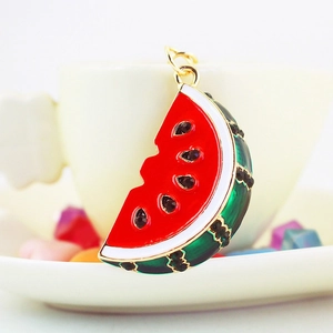 Cute gold-plated metal watermelon slice keychain with red enamel and black rhinestones