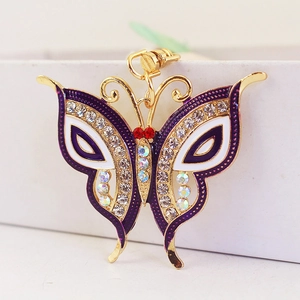Sparkling butterfly keychain with purple enamel wings and rhinestones on a gold alloy base