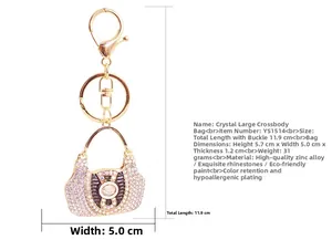 Detailed view of rhinestone handbag keychain with dimensions 5.7cm x 5.0cm on white surface