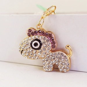 Sparkling rhinestone lion animal keychain with gold metal base and purple accents