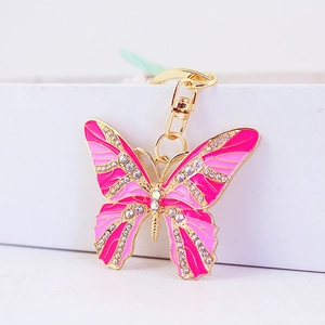 Sparkling pink enamel butterfly keychain with rhinestones on a gold alloy frame