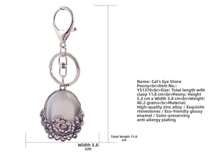 Detailed view of cat eye stone peony keychain with zinc alloy and rhinestones