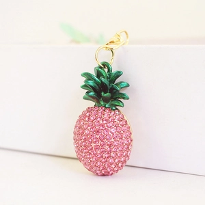 Creative pink rhinestone pineapple keychain with green enamel leaves on gold clasp