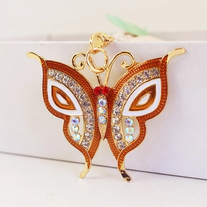 Colorful crystal butterfly keychain with orange enamel wings and gold plated metal ring