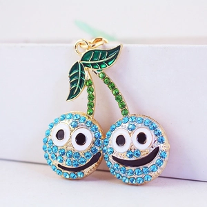 Porte-clés cerise en strass bleu avec design smiley et anneau en alliage doré