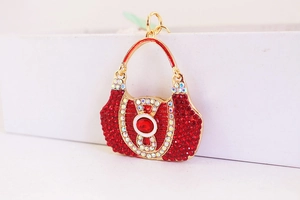 Macro shot of red rhinestone handbag keychain pendant with elegant gold plating finish