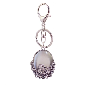 Elegant opal flower keychain with grey cat-eye stone and rhinestones on silver metal base