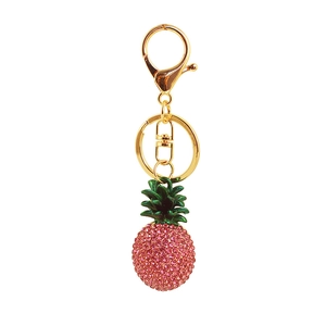 Pink rhinestone pineapple keychain with green leaves and gold-tone swivel clasp