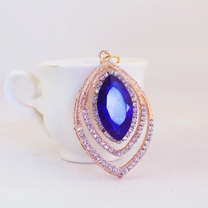 Peacock feather crystal keychain with deep blue gemstone and rose gold finish