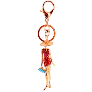 Chic rhinestone keychain for girls featuring a lady in red dress and blue handbag