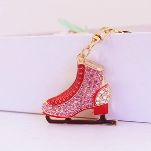 Sparkly rhinestone ice skate keychain with pink crystals and red enamel detailing