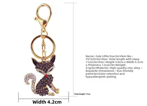 Dettaglio portachiavi a volpe dorata con strass viola e indicazione delle dimensioni