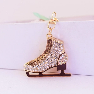 Sparkly rhinestone ice skate keychain with gold metal frame and lobster clasp charm