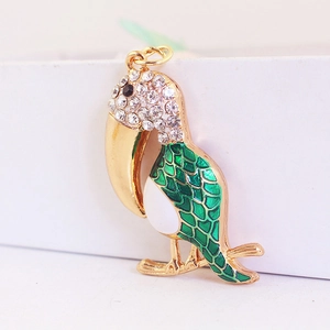 Pendentif toucan chic avec émail vert et strass scintillants pour porte-clés