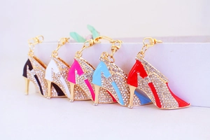 Detail view of colorful rhinestone high heel keychains in gold alloy plating