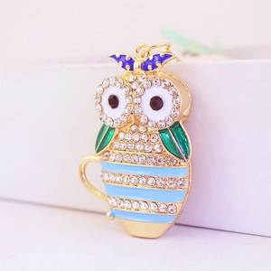 Creative owl tea cup keychain with sparkling rhinestones and green enamel wings