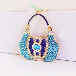 Exquisite handbag-shaped keychain with blue rhinestones and gold alloy metal base