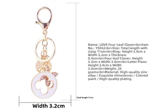 Detailed view of rhinestone clover keychain with LOVE pendant and size dimensions