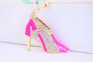Detailed close-up of pink enamel high heel keychain with sparkling crystals and gold metal