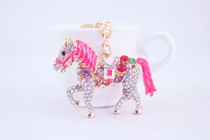 Close-up of a sparkling rhinestone horse keychain with colorful crystals and enamel details