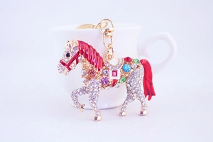 Detailed view of horse-shaped rhinestone keychain with colorful gems and gold alloy finish