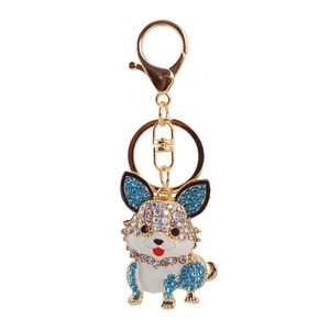 Detailansicht eines goldenen Corgi-Schlüsselanhängers mit blauen Straßsteinen