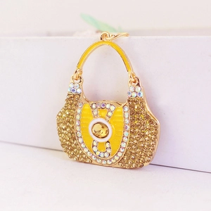 Creative crystal handbag keychain with yellow rhinestones on a gold metal base