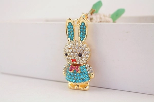 Close-up of cute metal rabbit keychain with sparkling colorful rhinestones for bags
