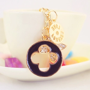 Golden and black enamel four-leaf clover keychain with rhinestones and Love Forever tag