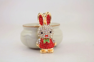 Close-up of cute long-eared bunny keychain with sparkling red and white rhinestones