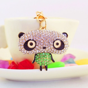 Creative rhinestone panda keychain with green and white crystals on a gold base