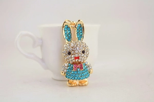 Close-up of sparkling rhinestone bunny keychain with colorful crystals and gold-tone finish