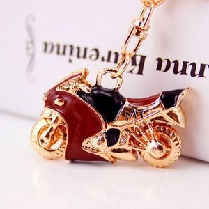 Portachiavi creativo a forma di moto in metallo dorato con strass e smalto rosso