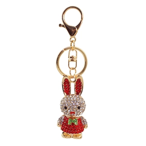 Exquisite gold alloy rabbit keychain with sparkling rhinestones and a green bow