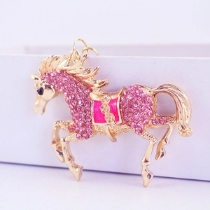 Sparkling pink rhinestone horse keychain on a golden metal base for bags and car keys