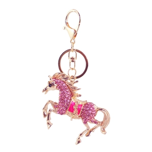 Crystal studded horse keychain in gold plating with pink rhinestones and ring clasp