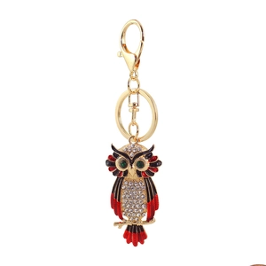 Detail of owl keychain with colorful rhinestones, gold plating and lobster clasp