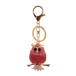 Sparkling rhinestone owl keychain with red and pink crystals on a golden branch charm