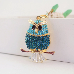 Sparkling blue rhinestone owl keychain accessory with gold-tone branch and crystal details