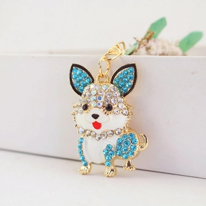 Funkelnder Corgi Hundeschlüsselanhänger mit blau-weißen Strasssteinen auf Goldbasis