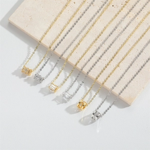 Detailed collection of minimalist zircon cylinder pendant necklaces in gold and silver
