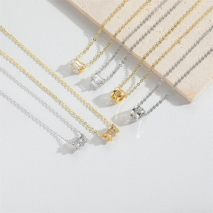 Elegant gold and silver tone zircon necklaces featuring geometric and bow pendants