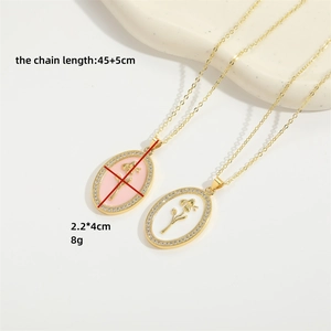 Pink and white enamel oval pendant necklaces with golden rose engraving and crystals