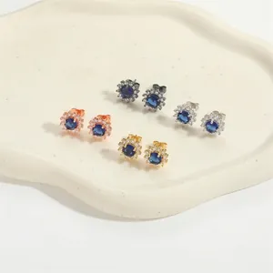 Set of four sunflower round blue zircon stud earrings in gold, silver, black, and rose gold