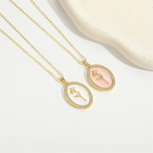 Elegant gold oval pendant necklace with enamel flowers and sparkling zircon stones