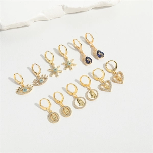 Set of 6 gold vintage hoop earrings with evil eye, star, and religious heart charms
