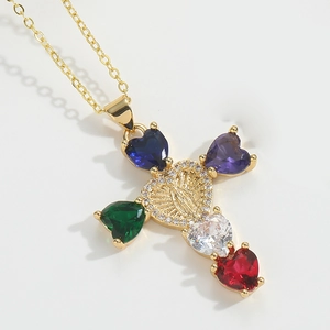 Detail of cross pendant featuring colorful heart stones and Virgin Mary emblem